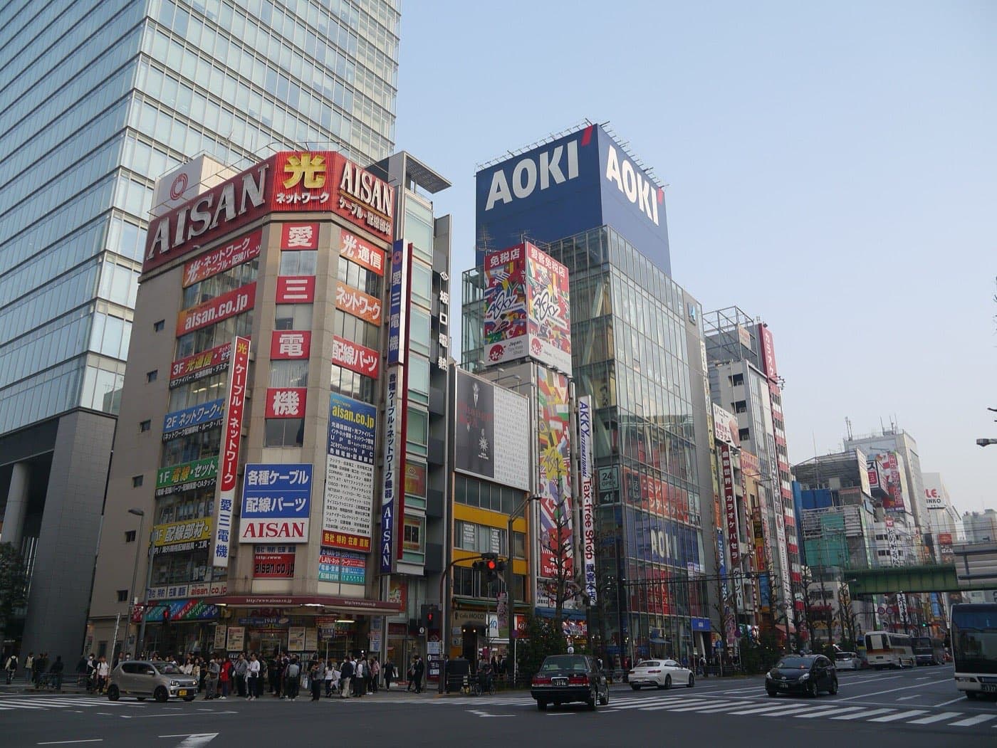 Corner of Akihabara Electric Town with tall shop buildings covered in signs